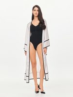 Front view of the BEYOURA Elysian Draped Hush Robe in coconut milk showing flowy draped design and contrast trim