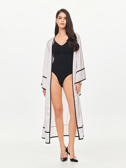 Front view of the BEYOURA Elysian Draped Hush Robe in coconut milk showing flowy draped design and contrast trim