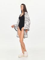 Left side view of the BEYOURA Riley Kimono-Style Hush Robe in marshmallow showing lightweight draped sleeves