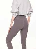 Medium close-up side-back view of the BEYOURA Estelle Bare Touch luxeFIT Leggings in grey