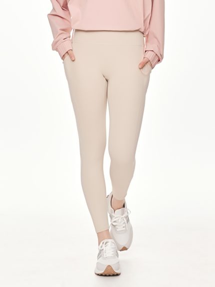 Close-up front view of the BEYOURA Estelle Cool Core luxeFIT Leggings in beige