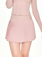Close-up front view of the BEYOURA Noelle Pleated luxeFIT Skort in pink